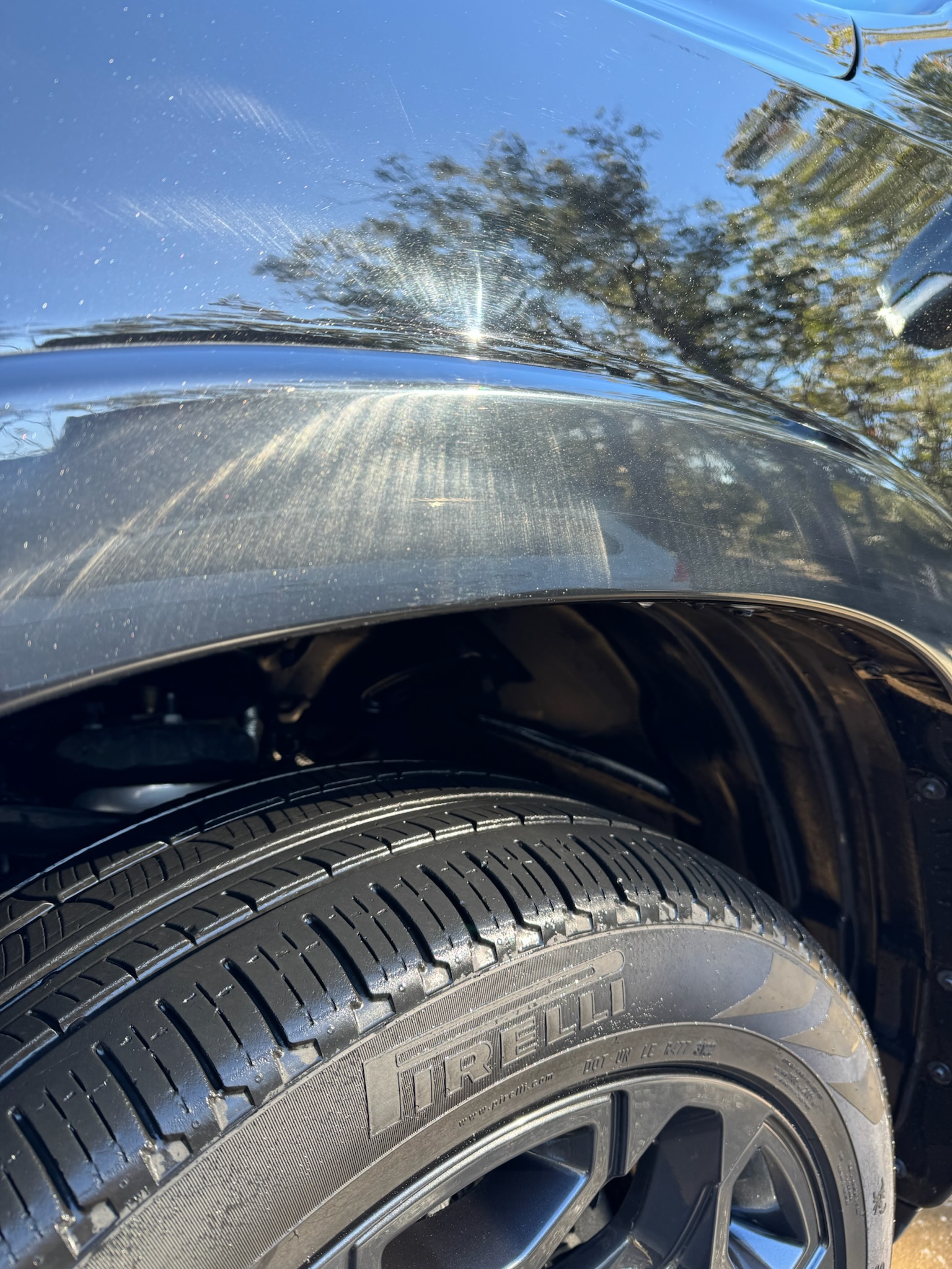 Before: swirl marks visible on black paint